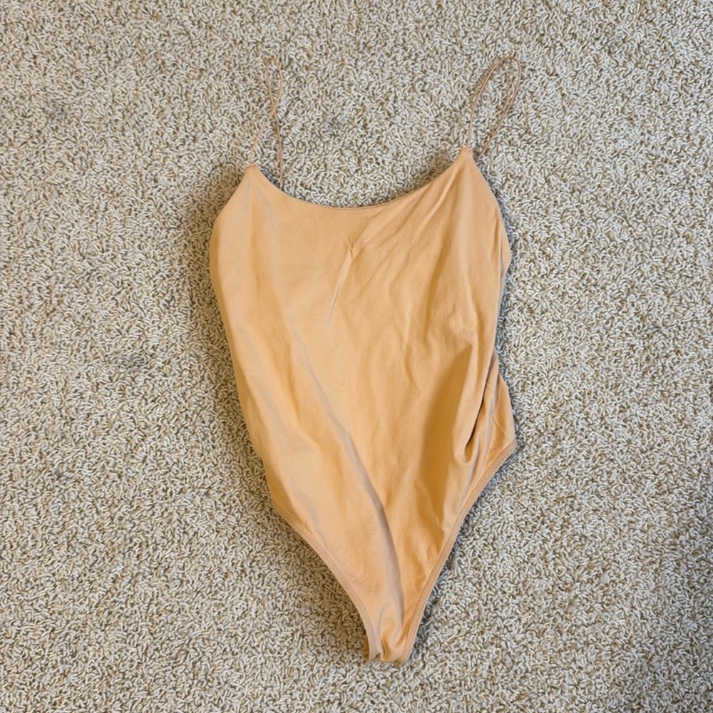 Yellow Free People bodysuit. Size medium-large.